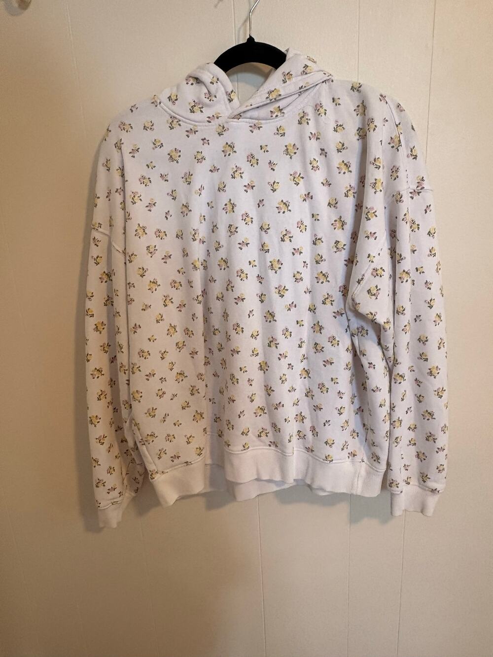 White hoodie with yellow and pink flowers